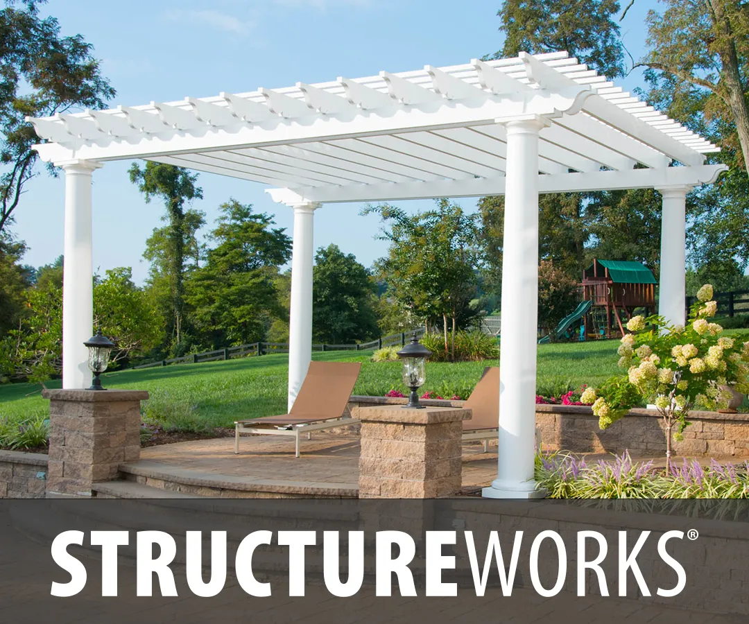 A fiberglass pergola shading an outdoor lounge area with the Structureworks logo.