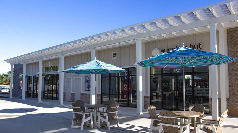 A Trex pergola shading a business front.